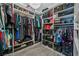 Walk-in closet with custom shelving and ample storage space for clothes and accessories at 10484 Rose Park Ave, Las Vegas, NV 89135