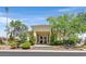 Community clubhouse with landscaped entrance and bright blue skies at 10484 Rose Park Ave, Las Vegas, NV 89135