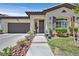 Inviting single-story home with a tidy front yard and cozy, covered entrance at 10484 Rose Park Ave, Las Vegas, NV 89135