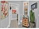 Hallway with a laundry room and charming decor at 10484 Rose Park Ave, Las Vegas, NV 89135
