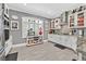 Bright, modern kitchen with white cabinetry, stainless steel appliances, and tiled backsplash at 10484 Rose Park Ave, Las Vegas, NV 89135