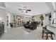 Spacious living room with modern furnishings, stylish decor, and natural light at 10484 Rose Park Ave, Las Vegas, NV 89135