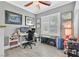 Bright office space with gray walls, ceiling fan, and ample storage at 10484 Rose Park Ave, Las Vegas, NV 89135
