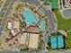 Aerial view showcasing resort-style amenities, pools, tennis courts, and expansive parking at 1073 Via Della Costrella, Las Vegas, NV 89101