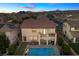 Aerial view of the property showcases the pool, spa, covered patio, and outdoor dining area at 1073 Via Della Costrella, Las Vegas, NV 89101