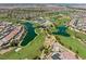 Beautiful aerial view of the community, golf course, and serene lakes creating a picturesque neighborhood setting at 1073 Via Della Costrella, Las Vegas, NV 89101