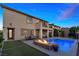 Outdoor oasis offers a pool, spa, and inviting fire pit with comfortable seating at 1073 Via Della Costrella, Las Vegas, NV 89101