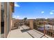 Relaxing balcony with outdoor seating and scenic neighborhood views under a blue sky at 1073 Via Della Costrella, Las Vegas, NV 89101