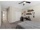 Inviting bedroom with soft carpet, ceiling fan, and a well-lit workspace at 1073 Via Della Costrella, Las Vegas, NV 89101
