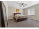 Serene bedroom featuring a large window, plush bedding, and a ceiling fan at 1073 Via Della Costrella, Las Vegas, NV 89101