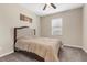 Comfortable bedroom with neutral decor, plush carpet, and ample natural light at 1073 Via Della Costrella, Las Vegas, NV 89101