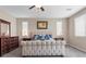 Well-lit bedroom with a tufted headboard, dark wood furnishings, and dual nightstands at 1073 Via Della Costrella, Las Vegas, NV 89101