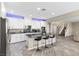 Modern kitchen with white cabinets, stainless steel appliances, and granite countertops at 1073 Via Della Costrella, Las Vegas, NV 89101