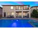A sparkling pool and spa highlight the backyard with a covered patio and dining area at 1073 Via Della Costrella, Las Vegas, NV 89101