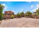 Backyard featuring a brick-paved patio with a sitting area, offering a peaceful outdoor space at 11238 Meadow Cove St, Las Vegas, NV 89179