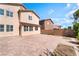 Spacious backyard with a brick-paved patio, providing ample space for outdoor gatherings at 11238 Meadow Cove St, Las Vegas, NV 89179