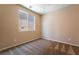 Cozy carpeted bedroom with a window providing natural light at 11238 Meadow Cove St, Las Vegas, NV 89179