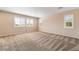 Large, sunlit bedroom with plantation shutters, neutral carpet and walls, and ample space at 11238 Meadow Cove St, Las Vegas, NV 89179
