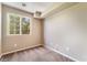 Cozy bedroom featuring neutral carpet and walls with a window view of trees at 11238 Meadow Cove St, Las Vegas, NV 89179