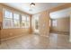 Bright dining area with tile floors, white trim, and large windows providing ample natural light at 11238 Meadow Cove St, Las Vegas, NV 89179