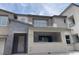 Modern townhome with a private entry, balcony, stone accents, and a welcoming facade at 11438 Crimson Ledge Ave, Las Vegas, NV 89138