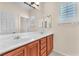 Bathroom with double sinks and vanities, plus a large mirror at 1155 Phillip Island St, Henderson, NV 89052