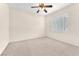 Bedroom with plantation shutters, carpet, and a ceiling fan at 1155 Phillip Island St, Henderson, NV 89052
