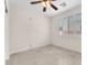 Neutral bedroom featuring tile floors, ceiling fan and large window at 1155 Phillip Island St, Henderson, NV 89052