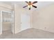 Simple bedroom featuring tile floors, ceiling fan and closet at 1155 Phillip Island St, Henderson, NV 89052