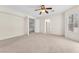 Large bedroom featuring neutral carpet, a ceiling fan, and an adjacent upper room at 1155 Phillip Island St, Henderson, NV 89052