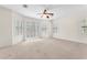 This spacious bedroom features neutral carpet, a ceiling fan, and plenty of natural light at 1155 Phillip Island St, Henderson, NV 89052