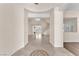 Open foyer with tile flooring, grand staircase and light-filled living spaces creating a welcoming atmosphere at 1155 Phillip Island St, Henderson, NV 89052