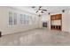 Spacious living room with a cozy fireplace, custom built-ins, and large windows offering natural light at 1155 Phillip Island St, Henderson, NV 89052