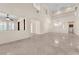 Expansive living room with tile floors, high ceilings, open layout, and views to a second-floor balcony at 1155 Phillip Island St, Henderson, NV 89052