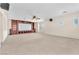 Spacious media room with custom built-ins and a ceiling fan at 1155 Phillip Island St, Henderson, NV 89052