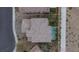 Aerial view of a home showcasing a red tile roof and backyard pool at 11952 Girasole Ave, Las Vegas, NV 89138