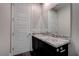 The bathroom features granite countertop, large mirror, and modern fixtures at 11952 Girasole Ave, Las Vegas, NV 89138