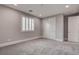 A carpeted bedroom with a closet, shuttered window, recessed lights, and neutral paint at 11952 Girasole Ave, Las Vegas, NV 89138