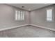 Neutral bedroom with white trim, carpet, and window shutters offer comfort and style at 11952 Girasole Ave, Las Vegas, NV 89138