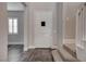 Bright foyer featuring tile floors, a white front door, and a view of the stairway at 11952 Girasole Ave, Las Vegas, NV 89138