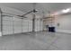 Spacious garage with clean epoxy floors and three overhead doors at 11952 Girasole Ave, Las Vegas, NV 89138