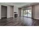 Spacious living room with a fireplace and access to the pool and backyard area at 11952 Girasole Ave, Las Vegas, NV 89138