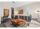 Cozy living room with stylish décor, including tile floors, comfortable seating, and modern accents at 11952 Girasole Ave, Las Vegas, NV 89138