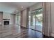 Open living area with fireplace, sliding glass doors to pool area offering natural light and seamless indoor/outdoor living at 11952 Girasole Ave, Las Vegas, NV 89138