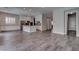 This open living room leads to the kitchen and features tile floors and recessed lighting at 11952 Girasole Ave, Las Vegas, NV 89138