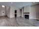 Open living room featuring a black fireplace and lots of natural light at 11952 Girasole Ave, Las Vegas, NV 89138