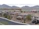 Aerial view of community featuring attractive homes with mountain views in the background at 11952 Girasole Ave, Las Vegas, NV 89138