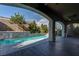 An inviting pool and beautiful backyard with water feature makes a relaxing oasis at 11952 Girasole Ave, Las Vegas, NV 89138