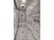 Modern shower with tile surround, bench, and rainfall shower head at 11952 Girasole Ave, Las Vegas, NV 89138