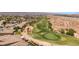Expansive aerial view of home with golf course in backyard and desert landscape nearby at 1309 Vista Del Monte Dr, Mesquite, NV 89027